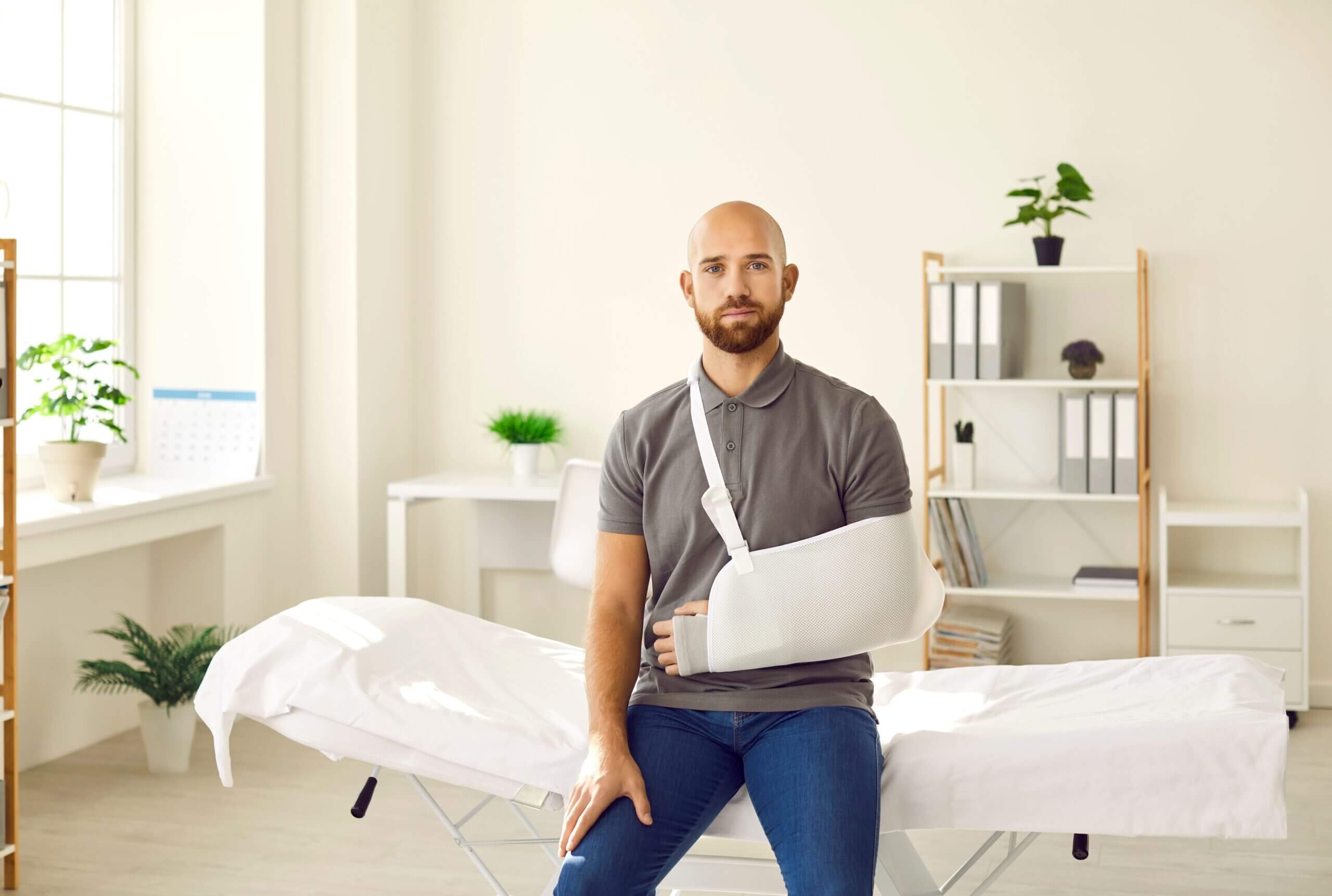 man with arn in a sling